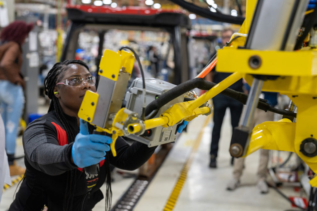 woman operating yellow piece of machinery | Rhino Tool House