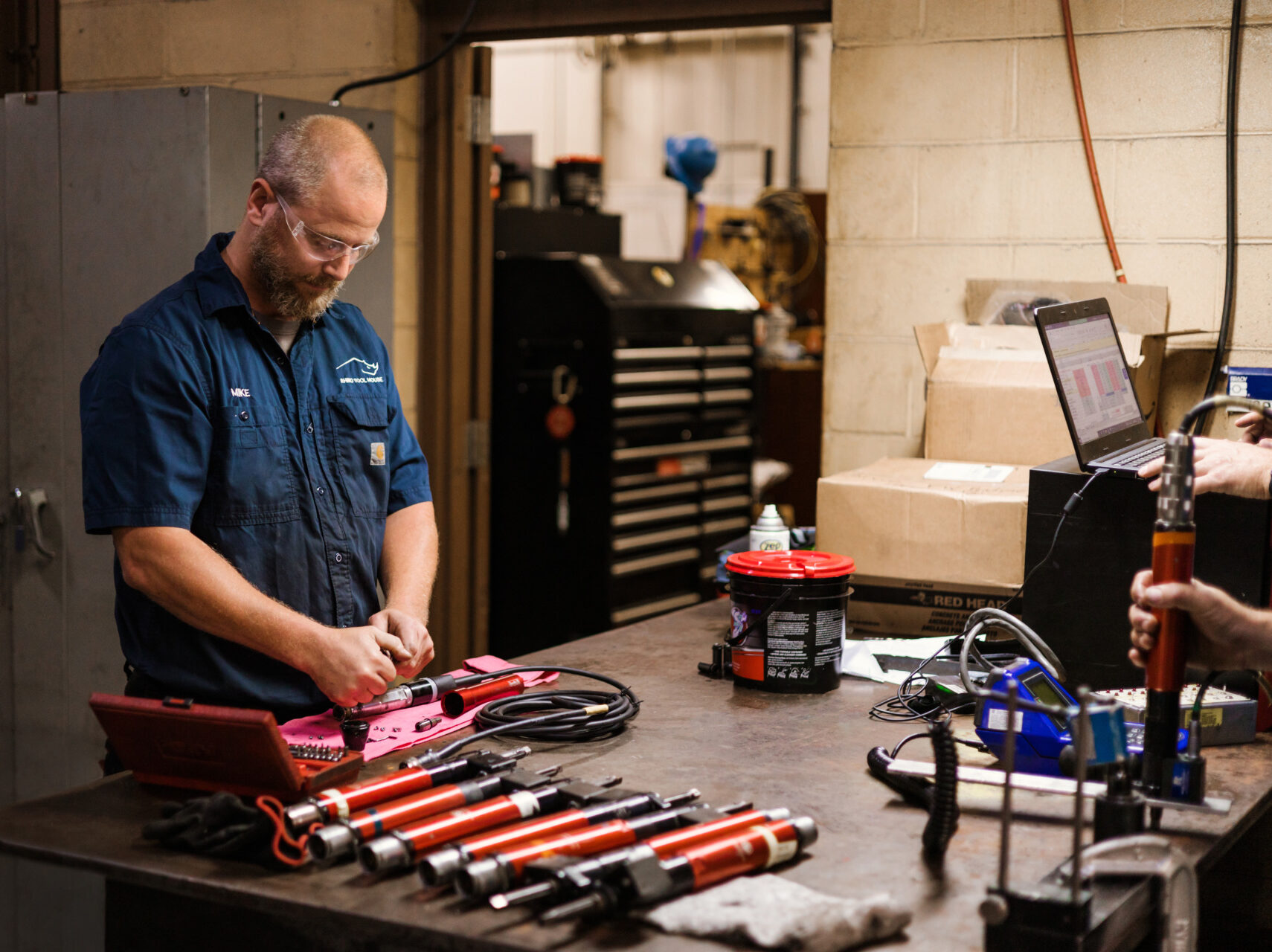 man organizing tools | Rhino Tool House