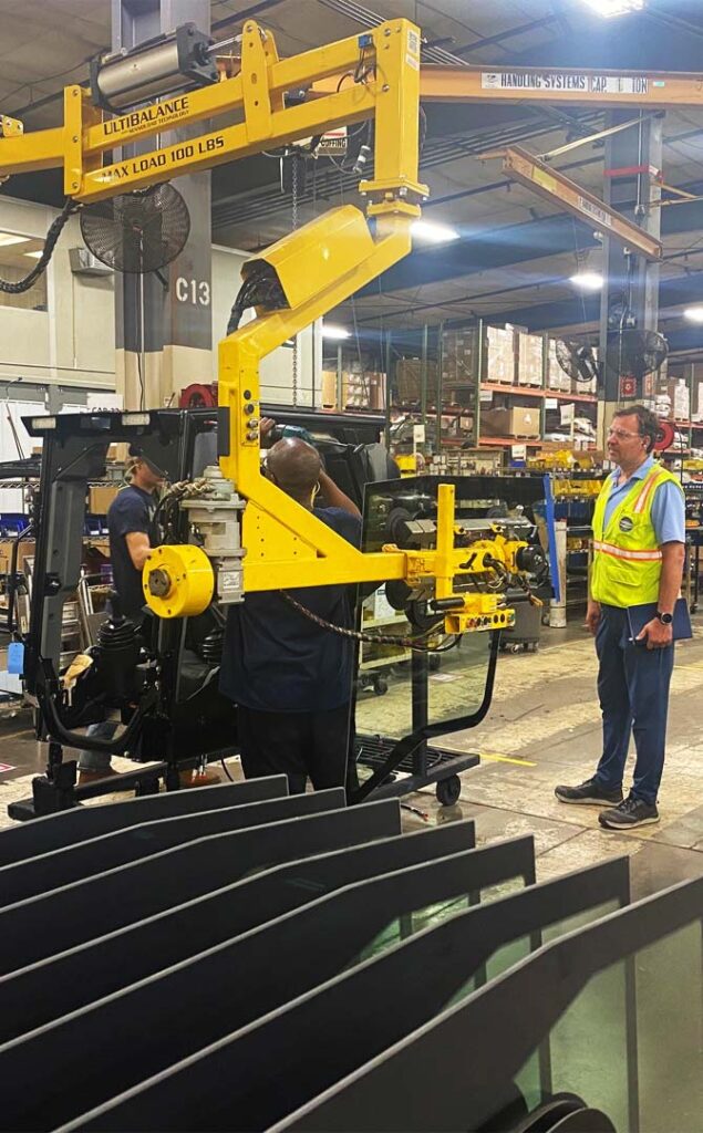 manager observing material handling process