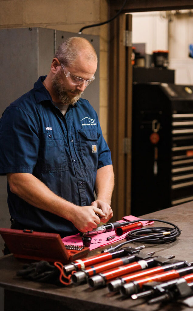 employee calibrating a torque wrench